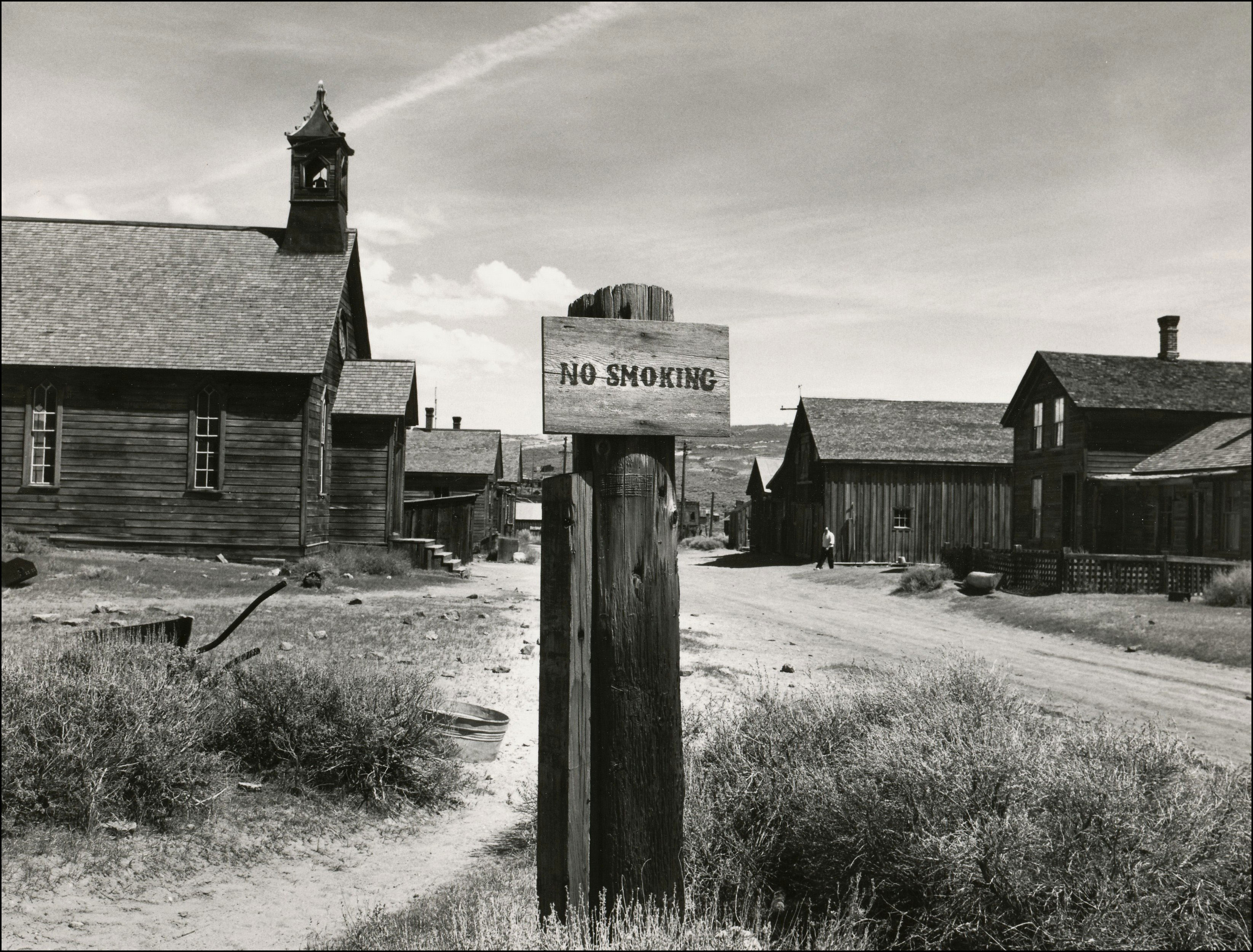 Ghost town with No Smoking sign in foreground