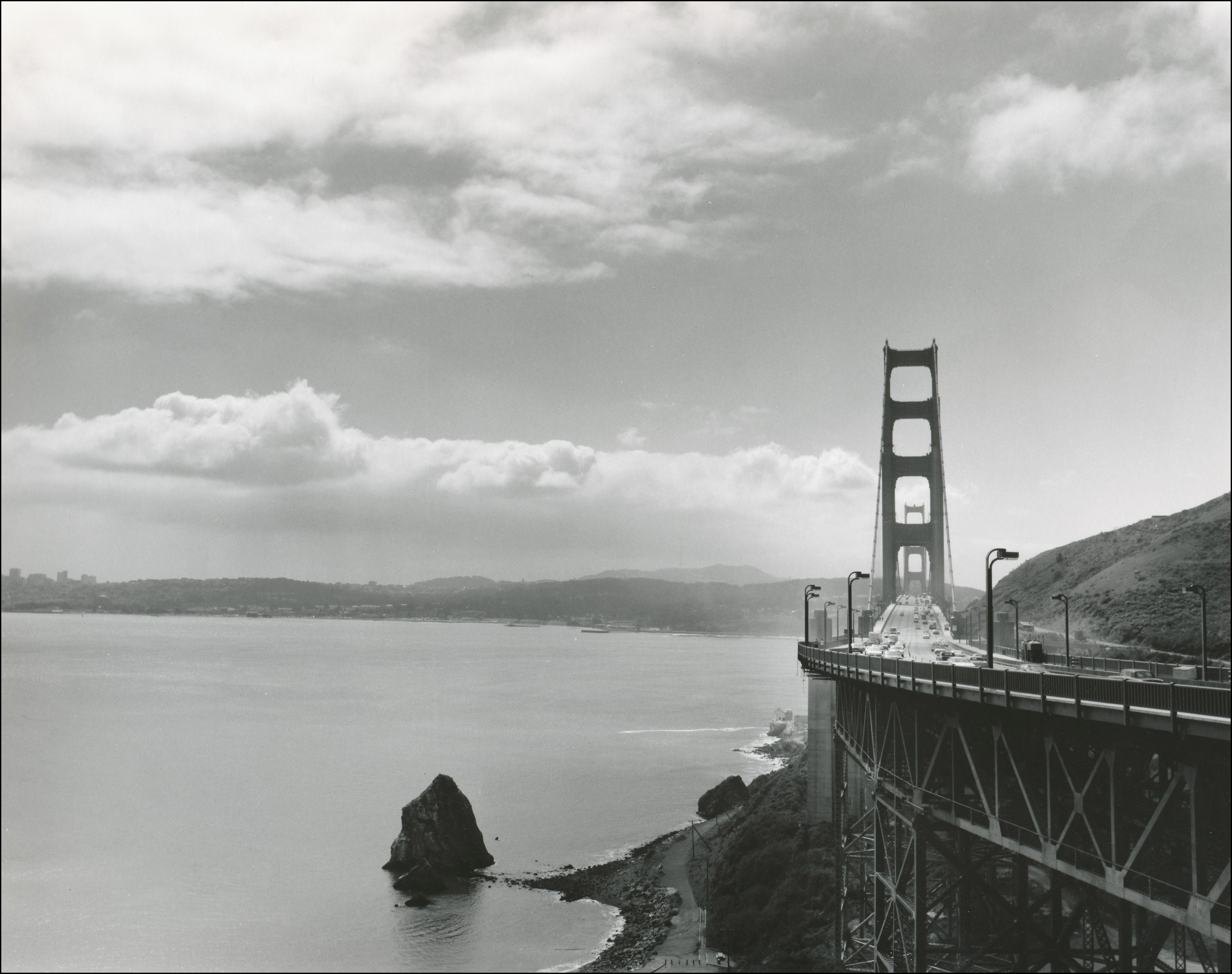 view of the Golden Gate bridge on the right side and San Francisco Bay
