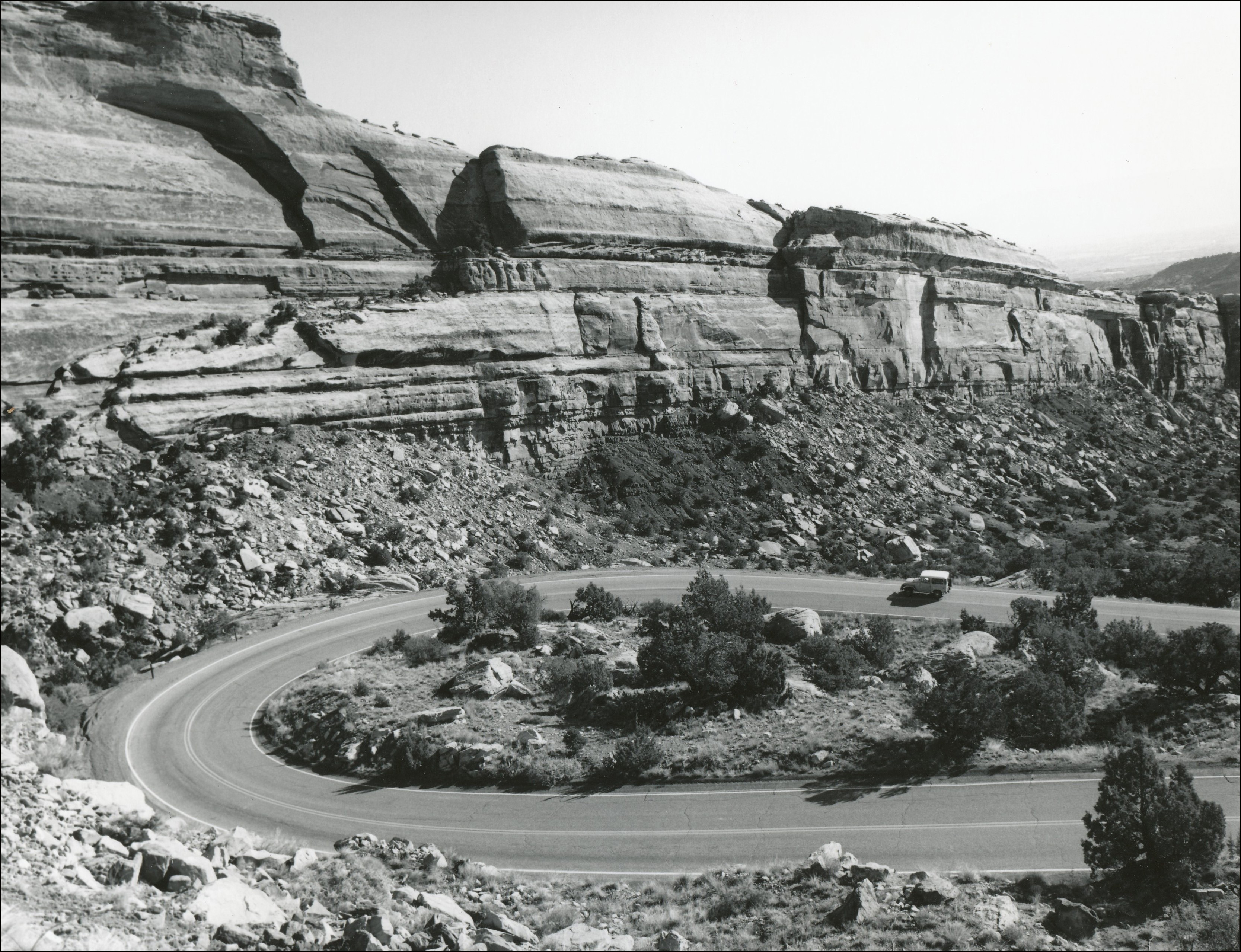 Large switchback on a paved road in a rocky mountain area